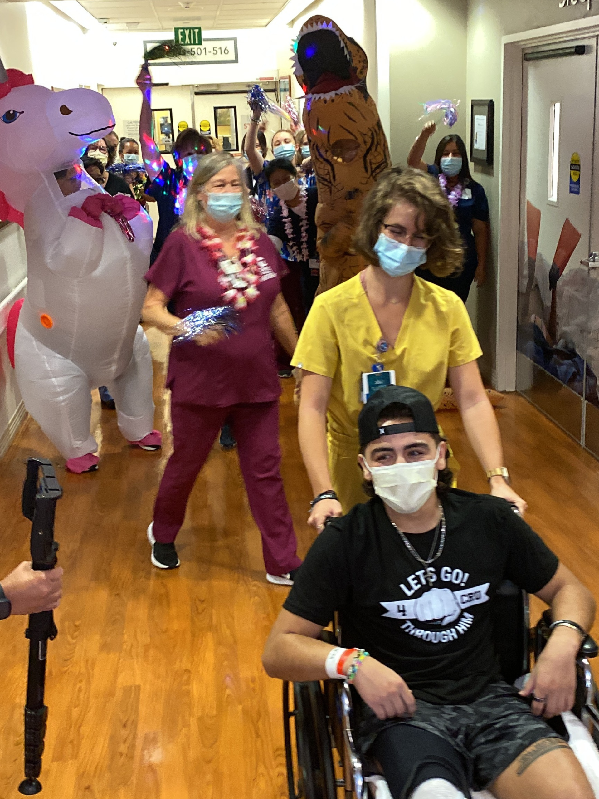 A nurse wheels a patient out of CHOC at Mission Hospital