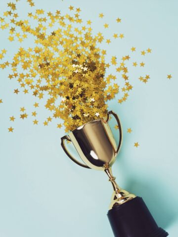 gold trophy with exploding stars from its top