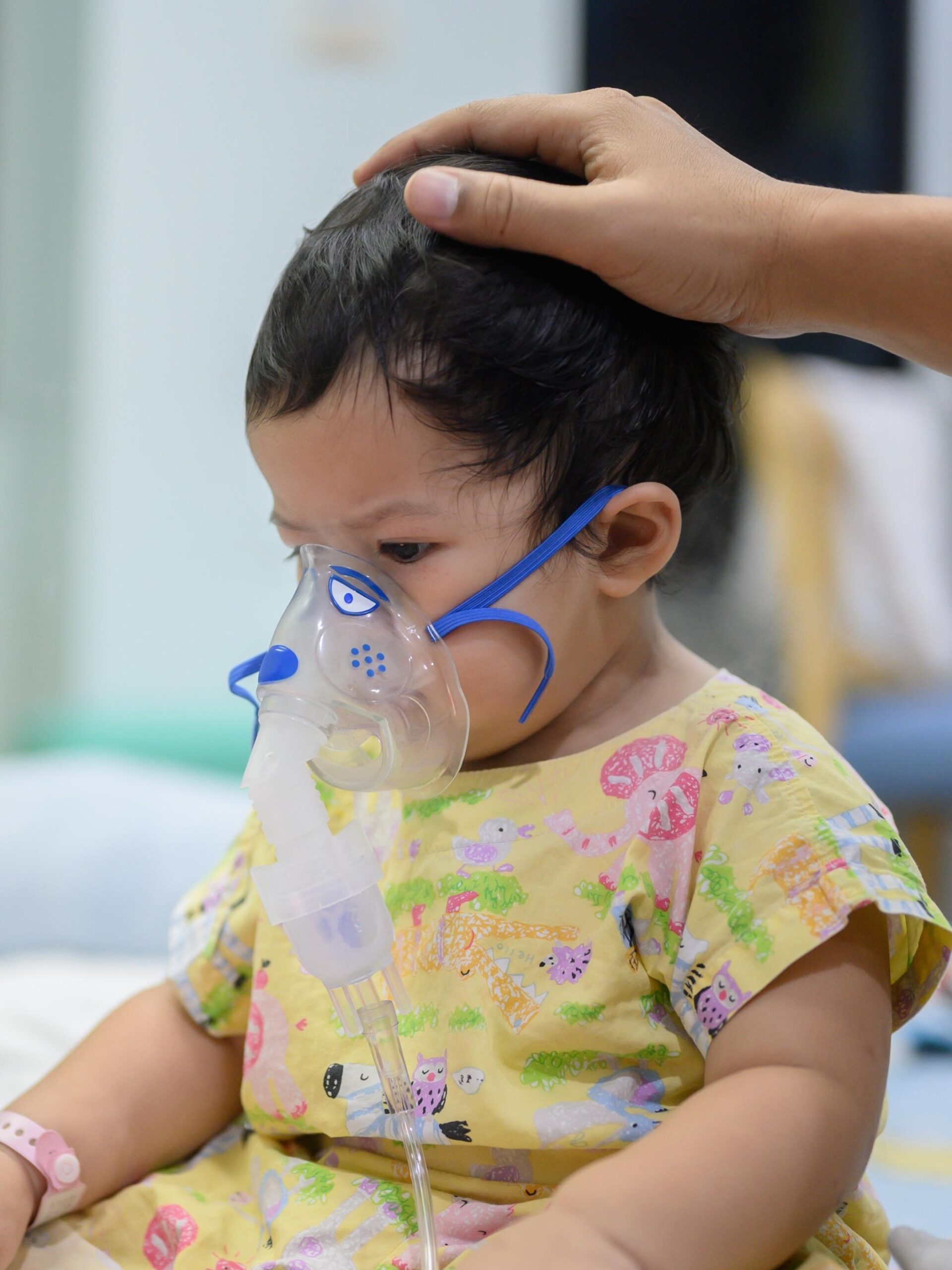 child with breathing support