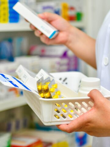pharmacist holding medications