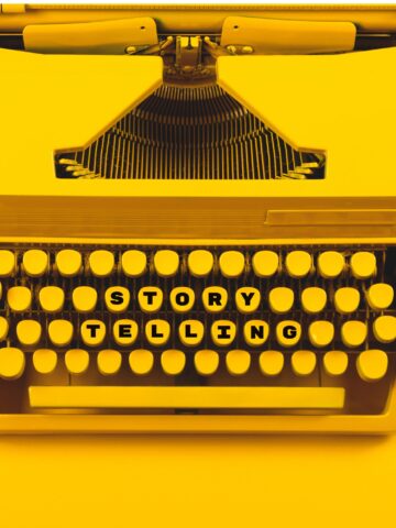 yellow typewriter with keys that spell storytelling