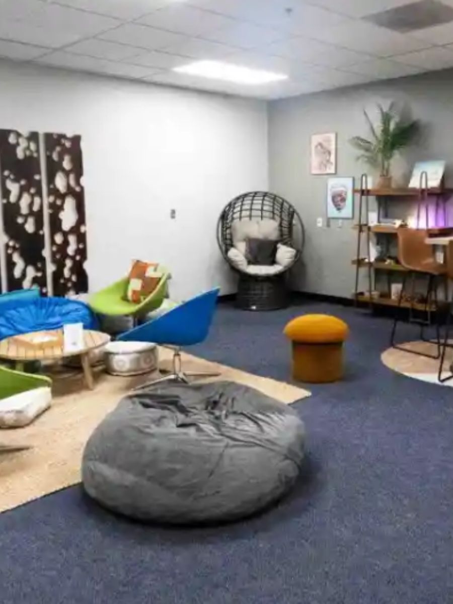 Interior room at school filled with comfy chairs and furniture - CHOC Wellspaces Initiative