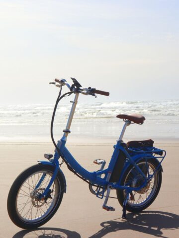 electric bike on the beach with ocean in the background