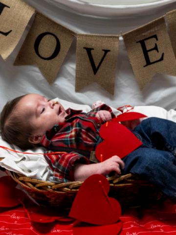 Patrick Alesandro Tejada smiles along side Valentine’s Day props during a photo shoot in the Neonatal Intensive Care Unit at Children’s Hospital of Orange County in Orange on Wednesday.