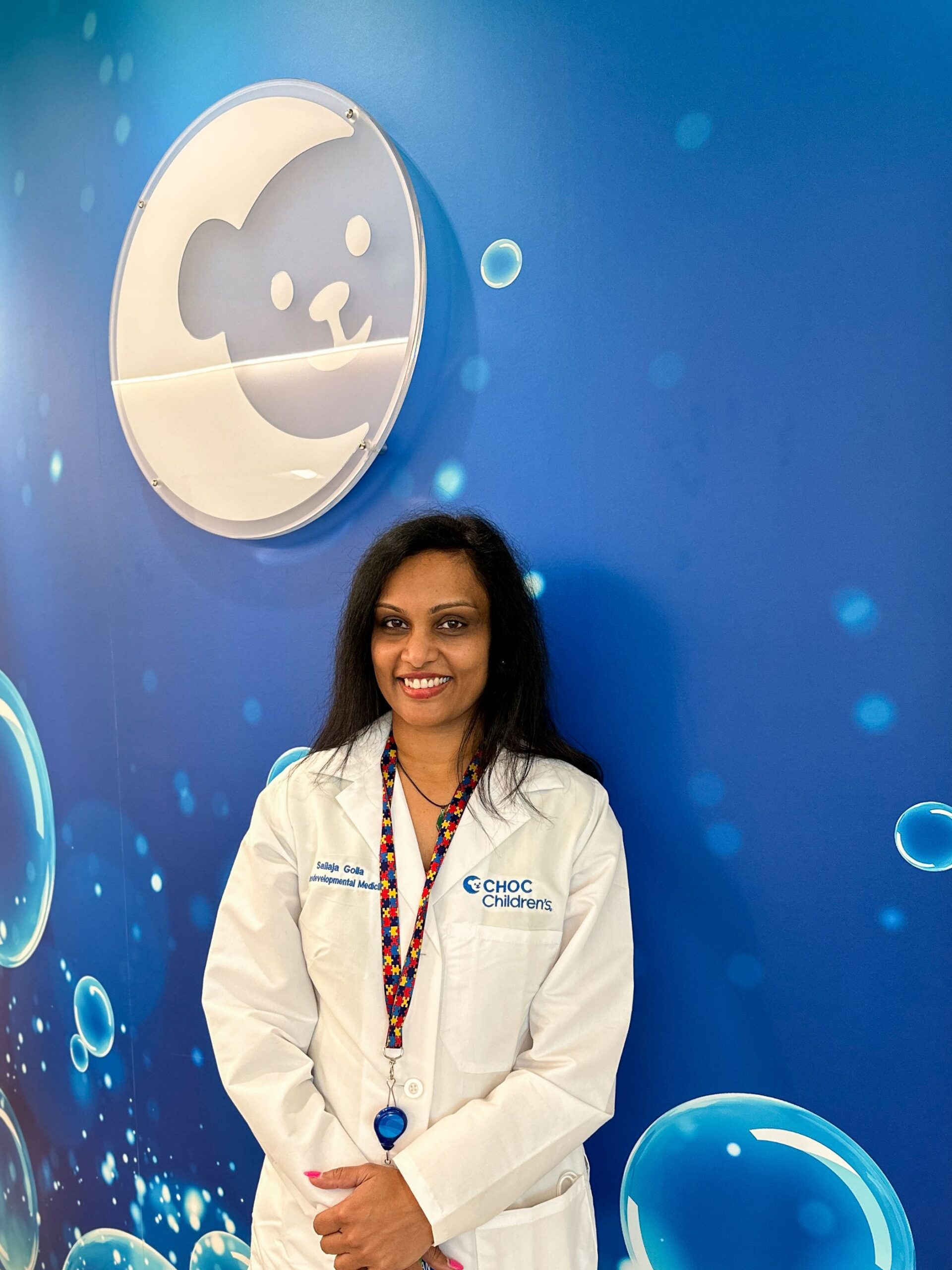 Doctor standing in front of Choco logo