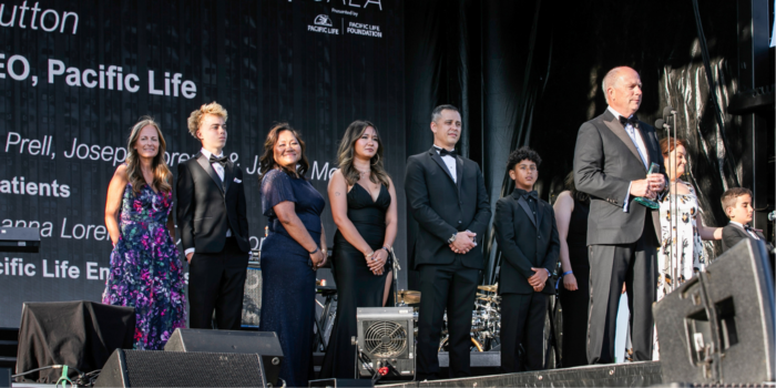 People on stage during charity gala