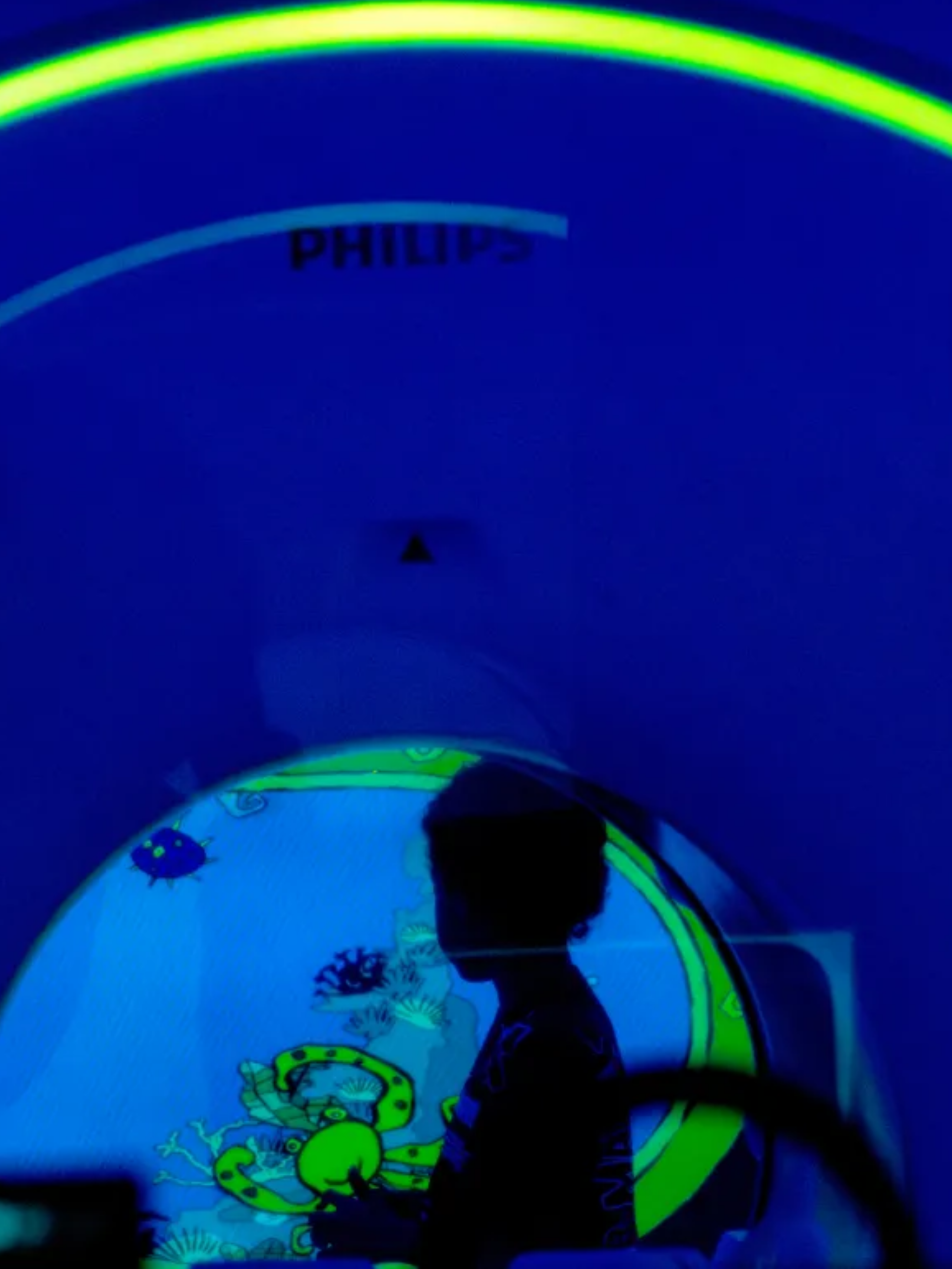 Eight-year-old Jordan Mosley recently received an “Ambient Experience” MRI scan at Rady Children’s Health Orange County. The new technology allows children to pick from different themes and colors while undergoing a procedure that requires them to remain still for up to two hours. He looks at projected animation on Wednesday, May 27, 2026. (Photo by Mindy Schauer, Orange County Register/SCNG)